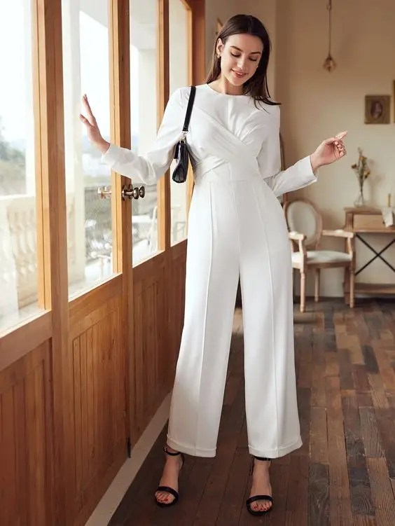 Woman wearing white jumpsuit in church