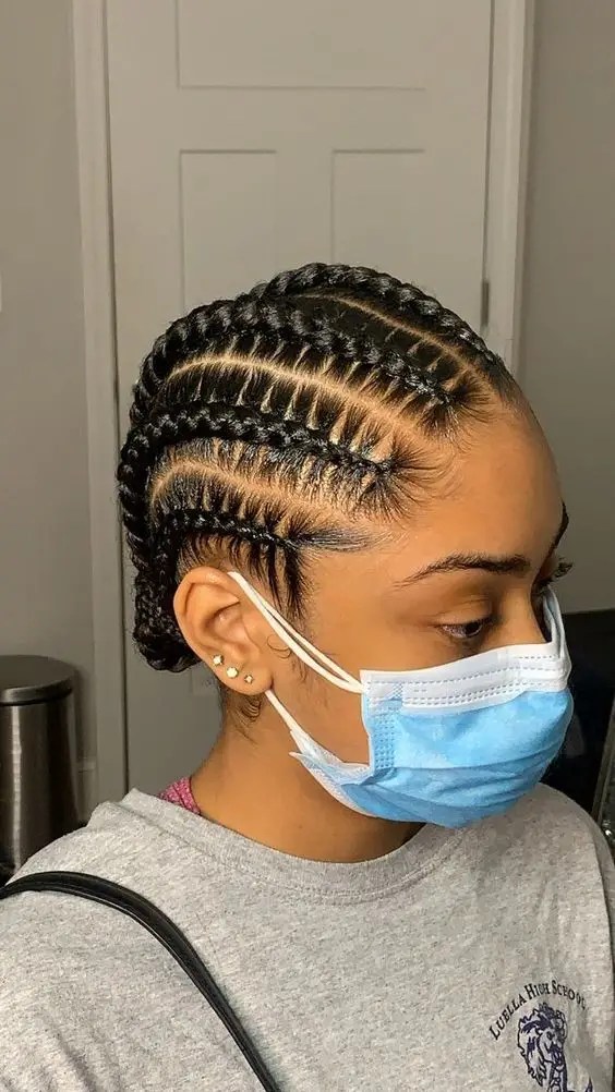 Woman wearing short braided braids with face mask