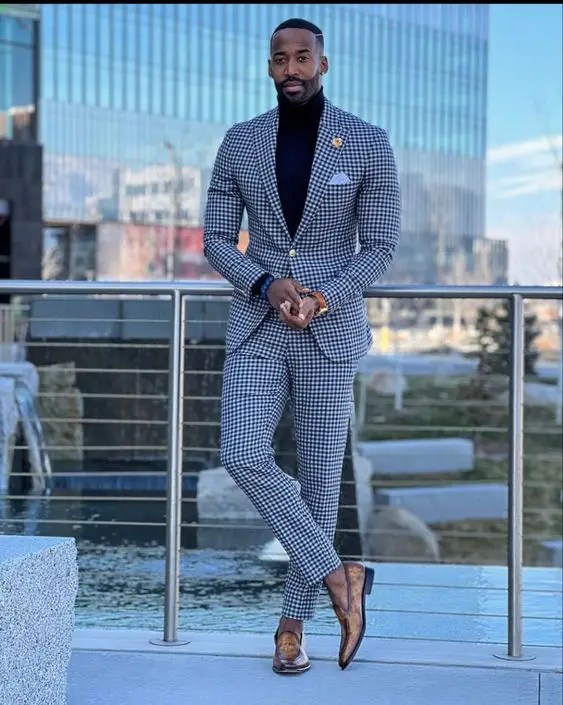 Man in gingham print suit demonstrating church attire