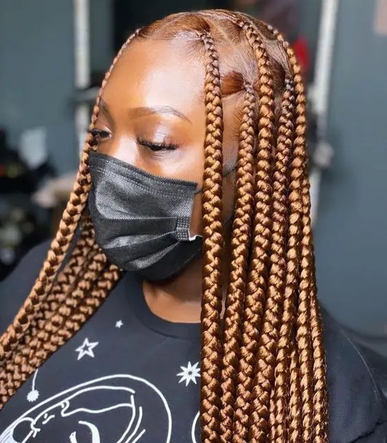 Woman locks gorgeous honey blonde braids
