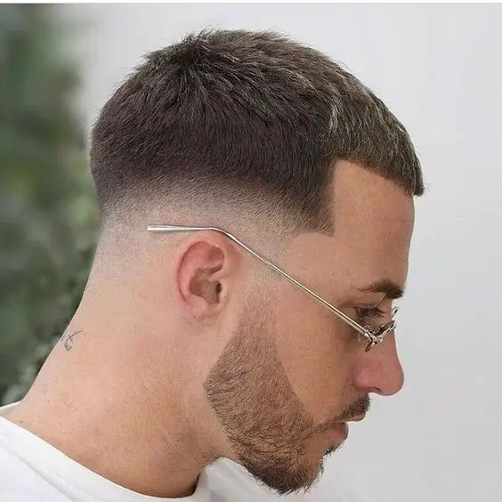 Close up view of a man rocking his neatly cut hairstyle with lenses