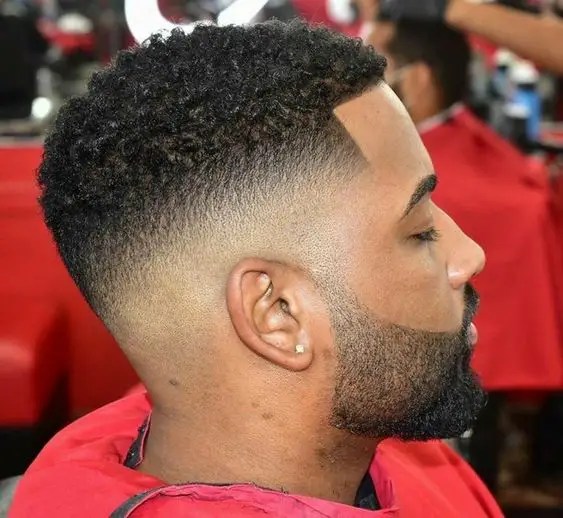 Side view of well groomed mid fade haircut