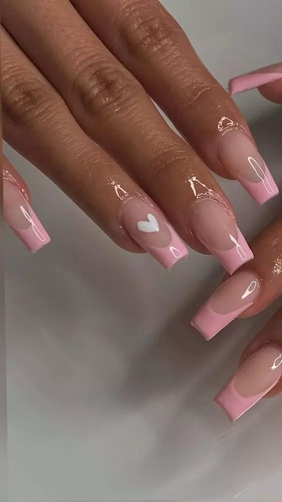 A cute nail design with glossy nails and pink stripes.