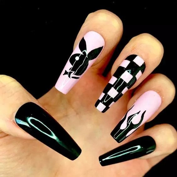 This glossy black and pink nail polish and some strips on top is one of the cutest nail designs to rock for summer.