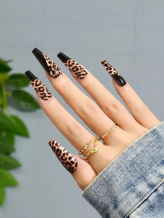 Leopard print nails with beautiful black stripes.