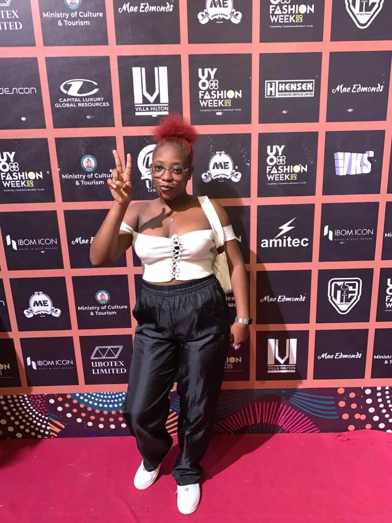 Nancy Umo shows off white crop top and track pants at Uyo Fashion Week