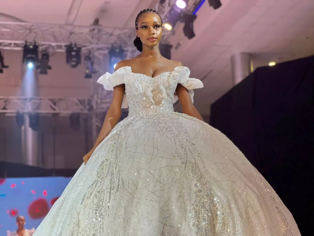 Attractive beautiful model wearing bridal wear at runway show