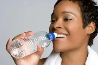 smiling lady drinking water