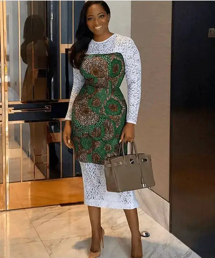 lady's dress combines ankara and white lace