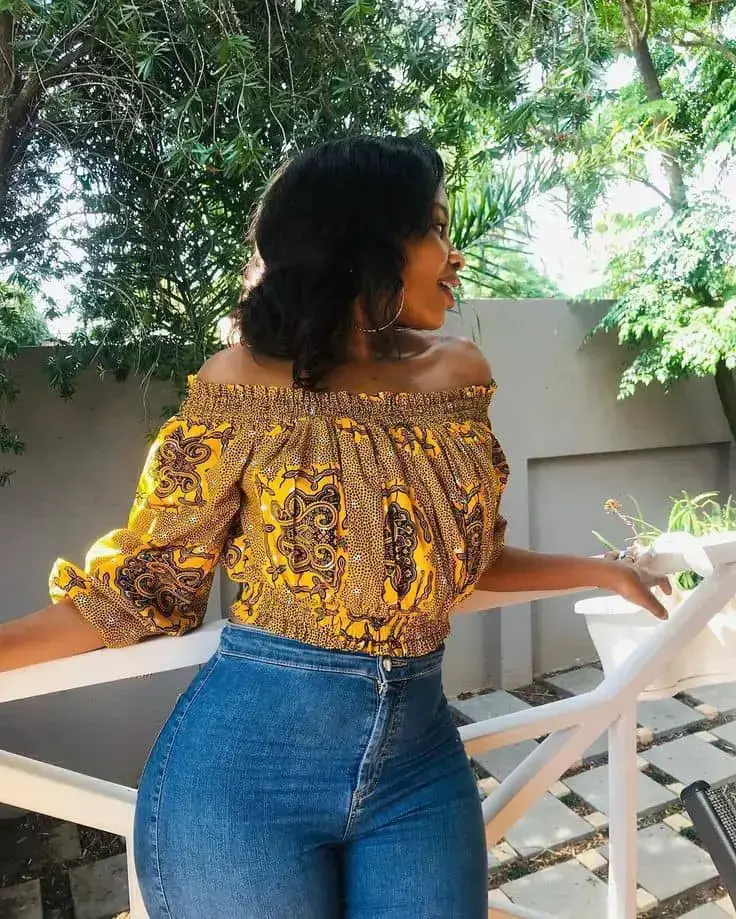 lady wearing ankara top with jeans