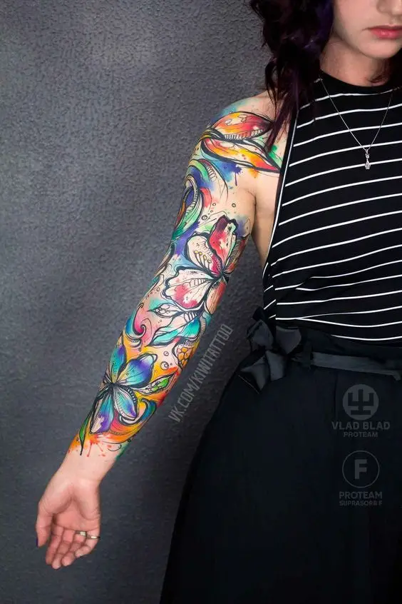 lady wearing a full colorful sleeve tattoo