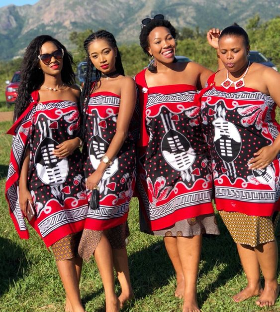 Four happy women rocking traditional Swazi clothing