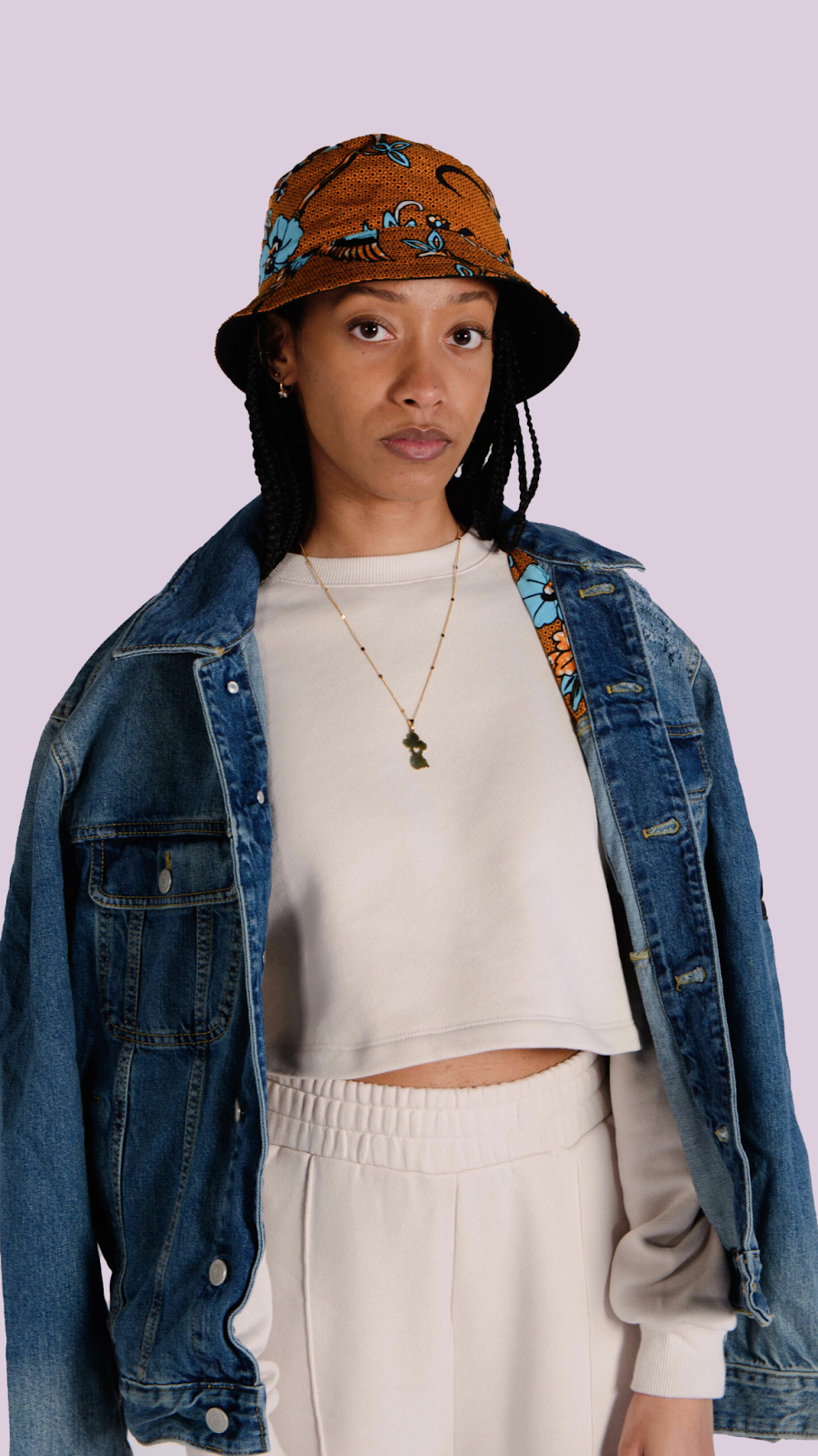Woman wearing ankara bucket hat and jean jacket