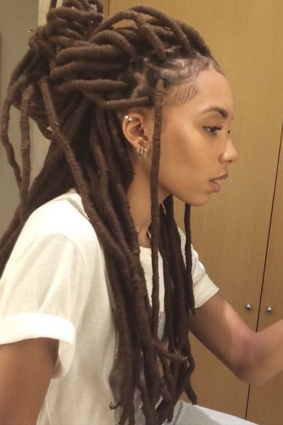 Profile of a woman showing dreadlocks with hairstyle extensions