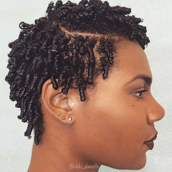 Woman wearing finger coils to style her natural short hair