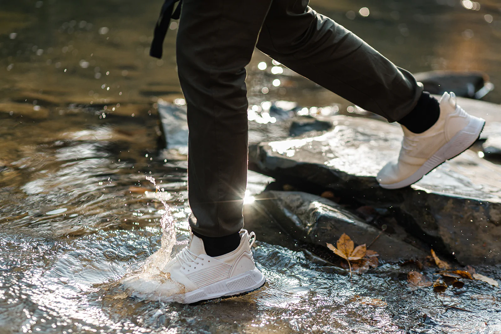 Man wearing waterproof sneakers underwater