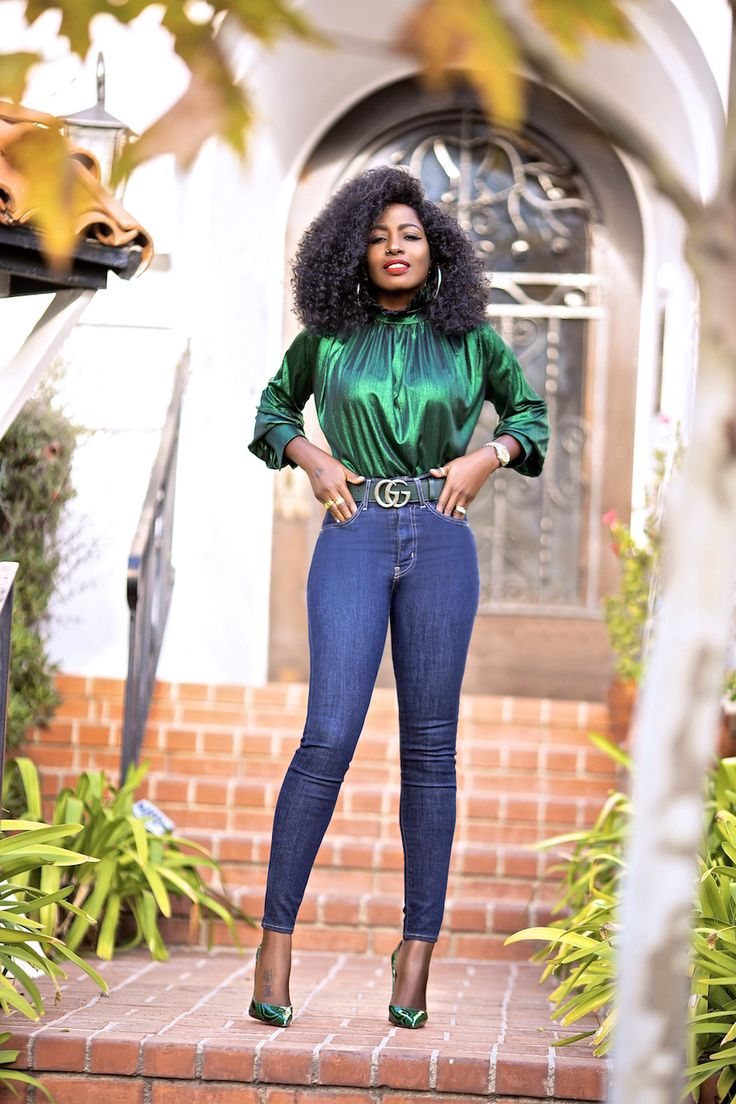 Woman wearing green top and jeans