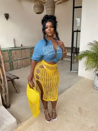 lady wearing top and yellow sheer pencil skirt