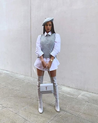 lady wearing swearter on her white shirt dress and knee-high boots