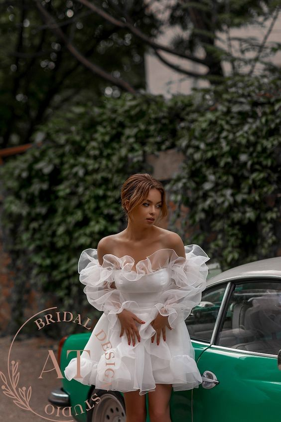 Woman wearing a short white dress as a casual wedding dress