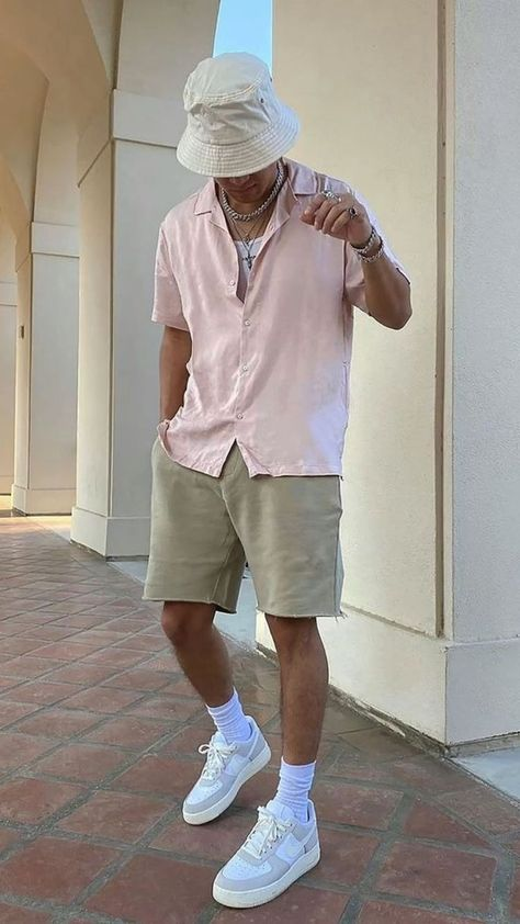 Man wearing shirt and shorts with other fashion accessories