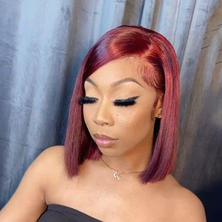 woman wearing red bob wig