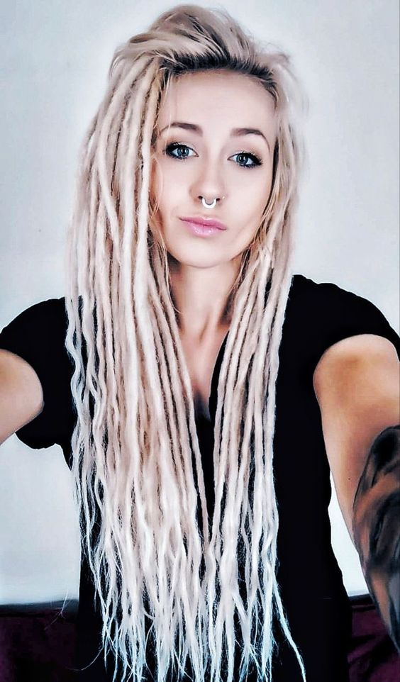 Woman rocking synthetic dreadlock extensions with a nose ring