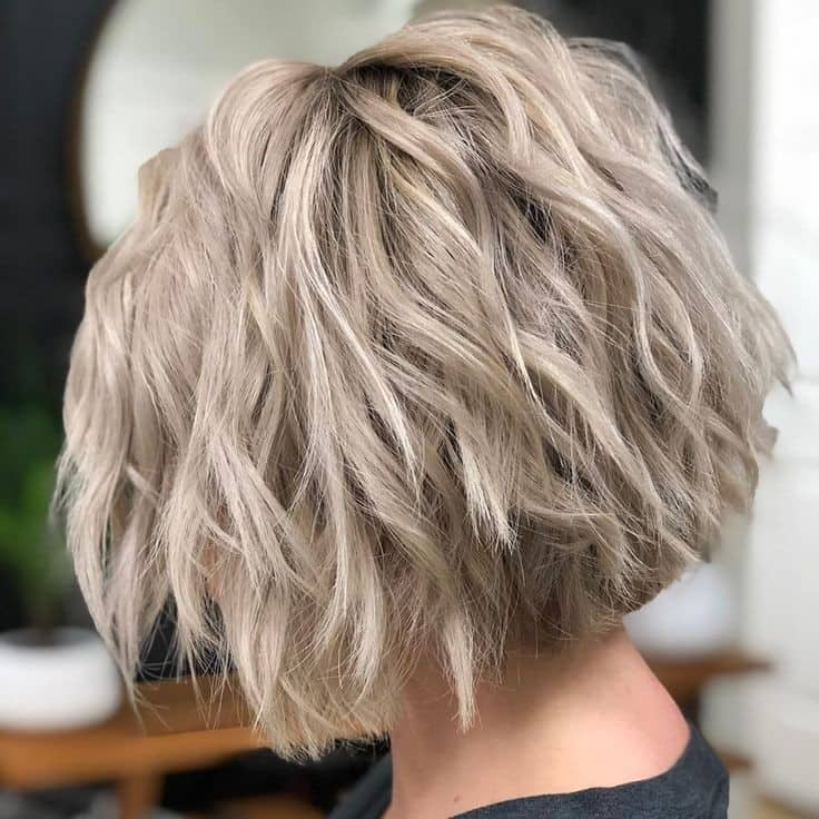 Woman wearing short layer hairstyle