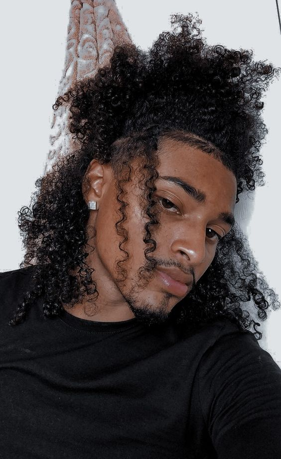 Sweet black guy showing off his long curly hair