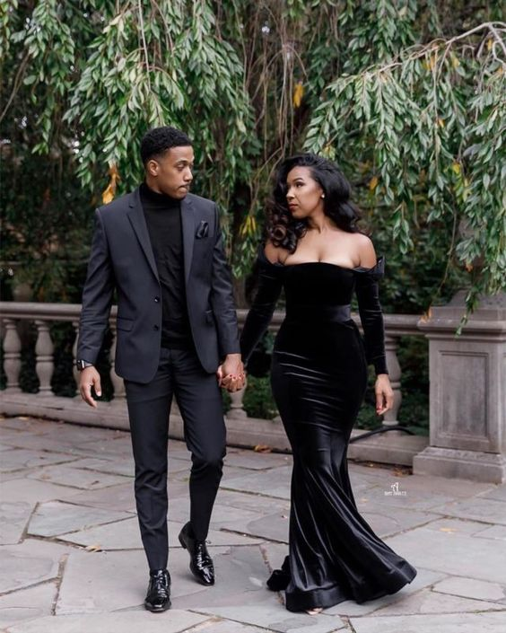Beautiful couple wearing matching black prom outfits for men