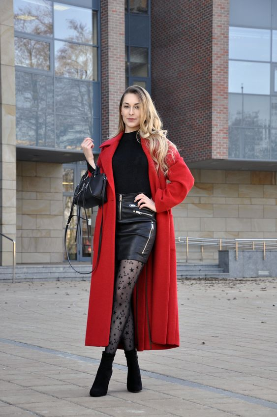 Raldi in a black miniskirt with a red long coat