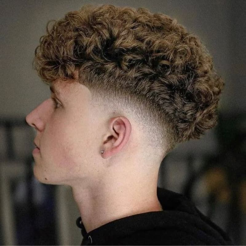 Profile of a man showing his hairstyle