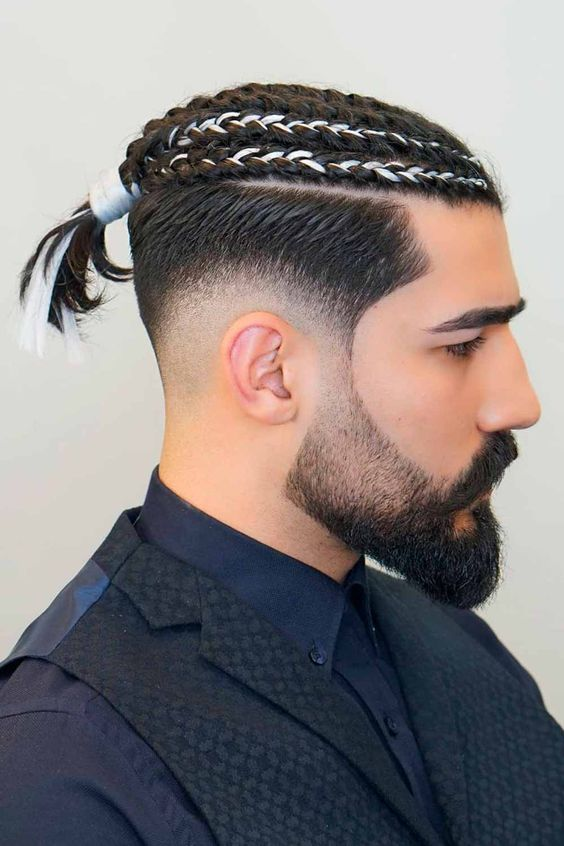 man wearing braided hair with fade