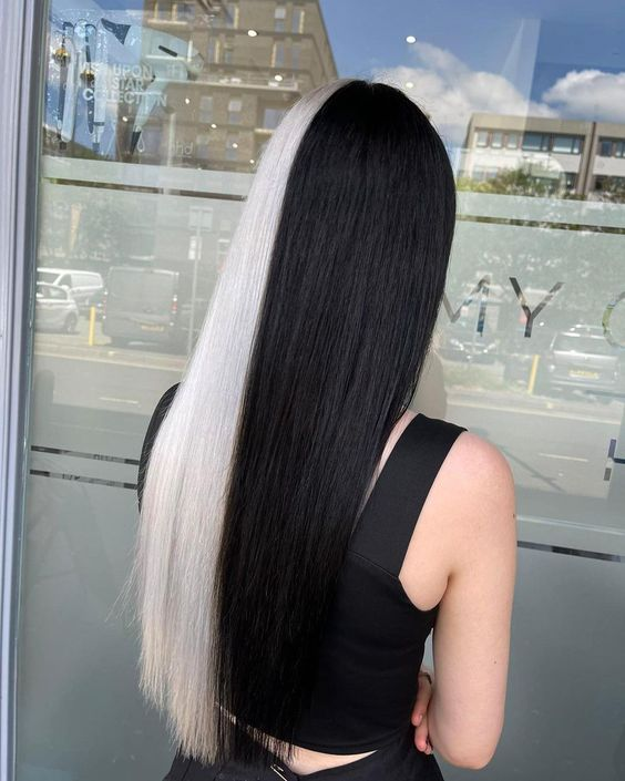 A woman with blonde highlights on her black hair