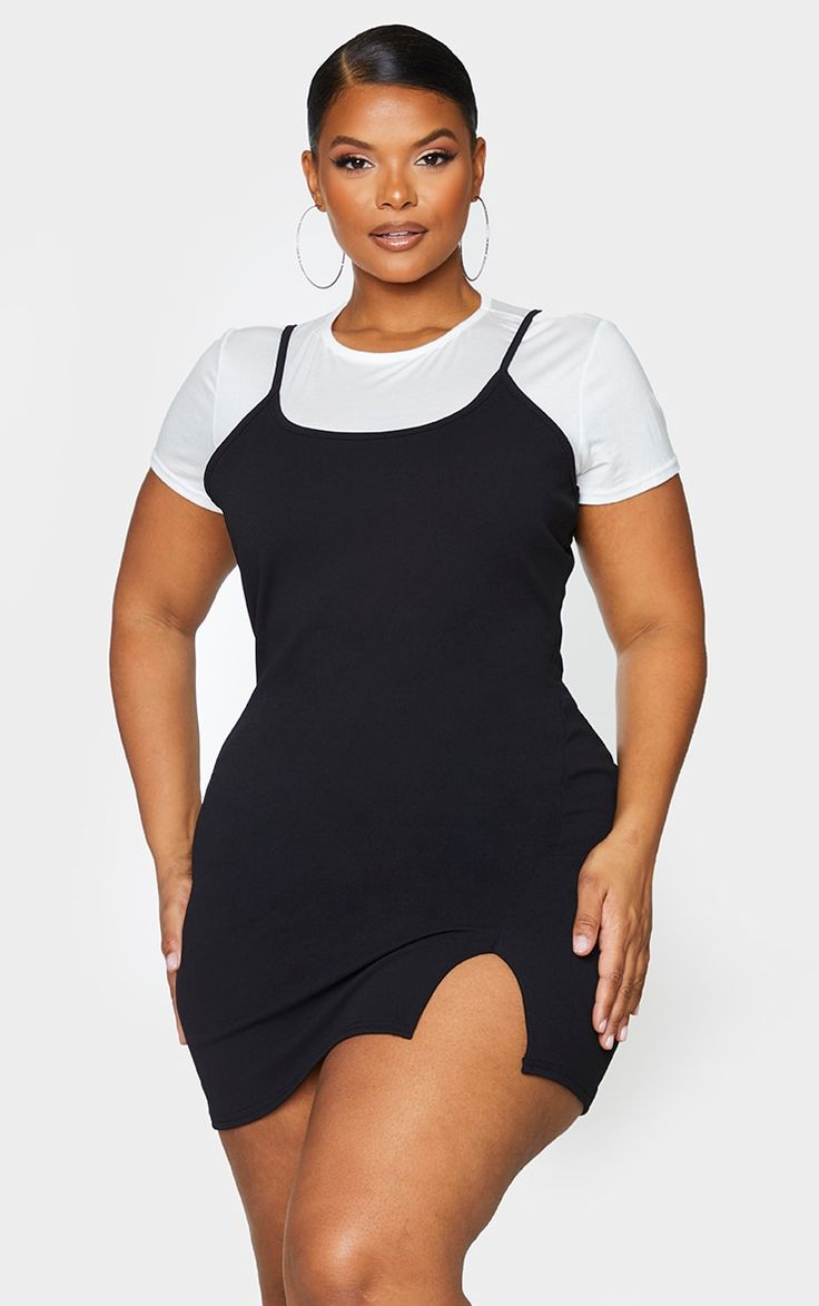 Woman layering white t-shirt over little black dress