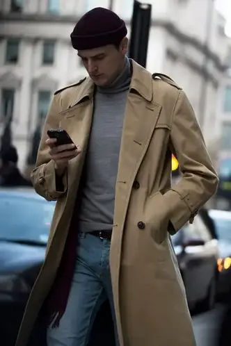 man wearing a turtleneck on jeans with brown overall and other fashion accessories