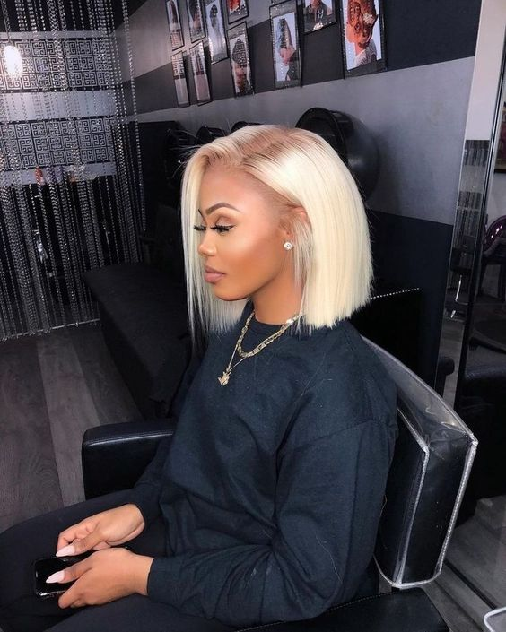 Woman wearing blunt cut bob blonde hairstyle