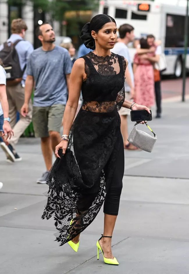 Woman wearing black midi sheer dress
