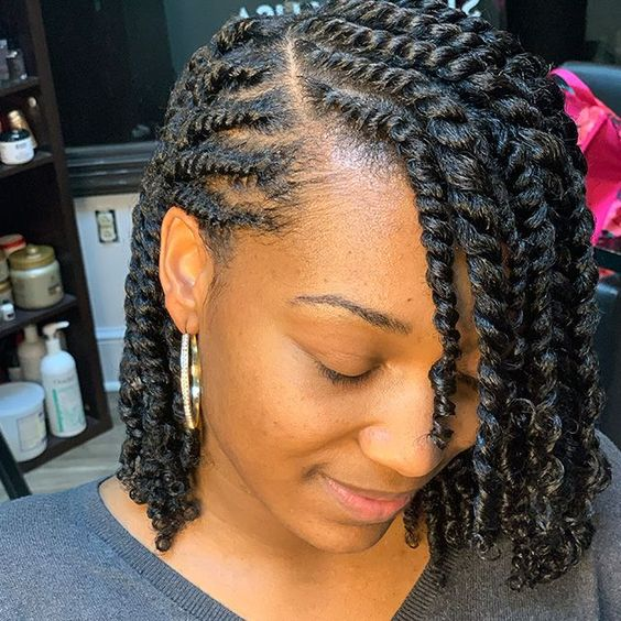 Woman wearing a bounce twist to style her natural short hair
