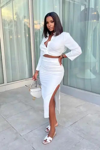 lady wearing white crop top on white pencil skirt