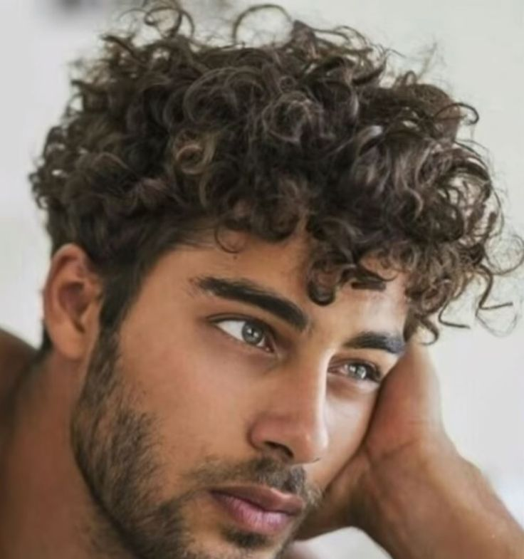man with curly male hairstyle