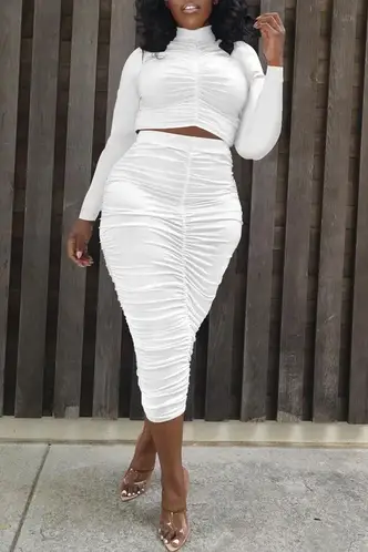 lady wearing white two-piece outfit with a pencil skirt