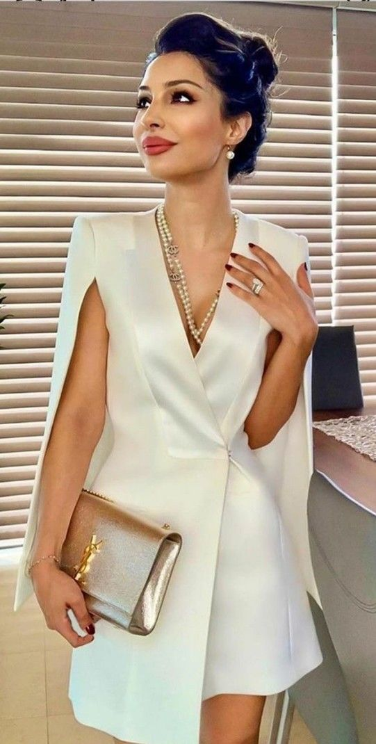 Beautiful woman in a stylish white dress