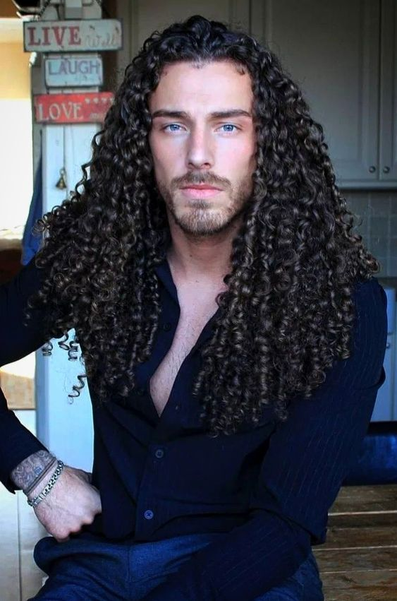 Gorgeous Caucasian man with long curly hair