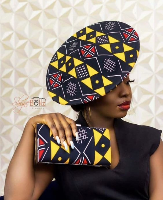 Woman with matching purse and ankara hat