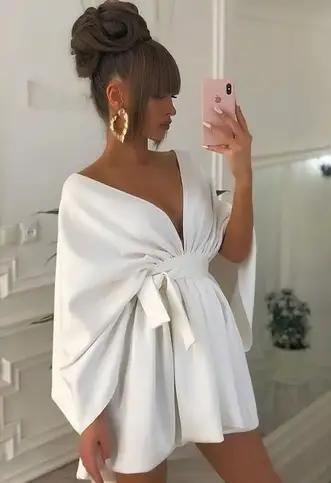 lady wearing LWD with statement earrings