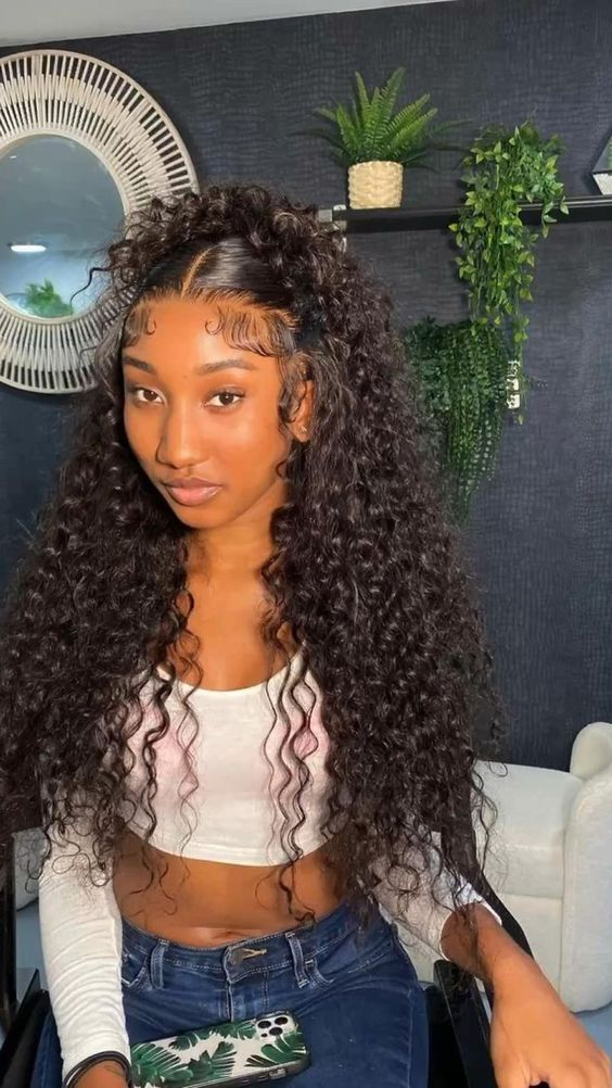 Pretty black woman wearing curly long wig