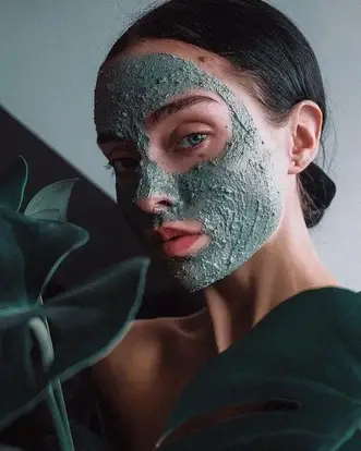 lady with chemical exfoliate on her face