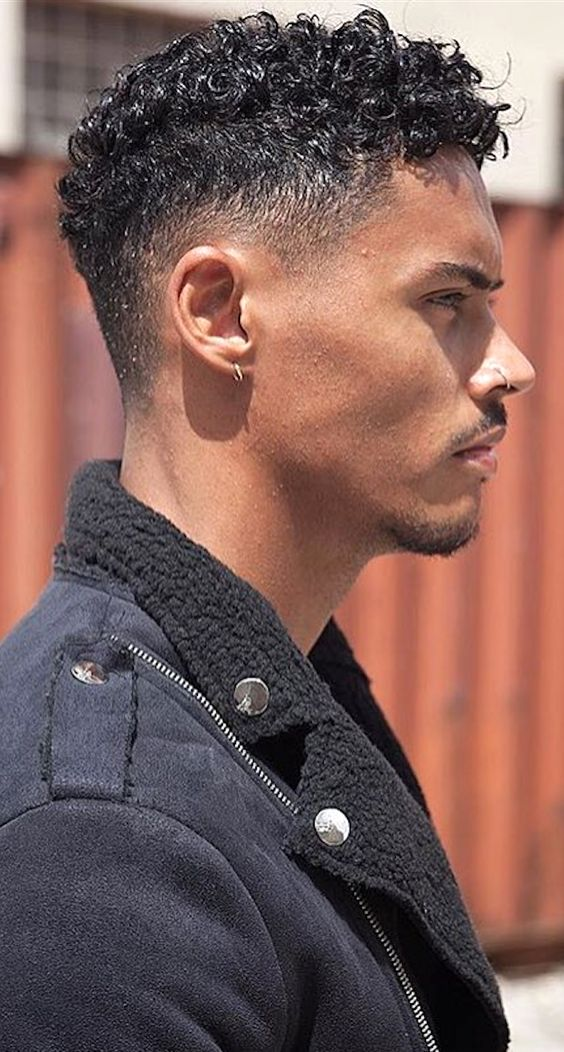 man with curly fade haircut