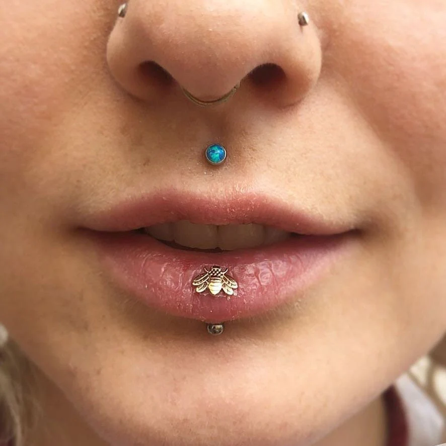 a lady rocking a lip piercing and another on her philtrum